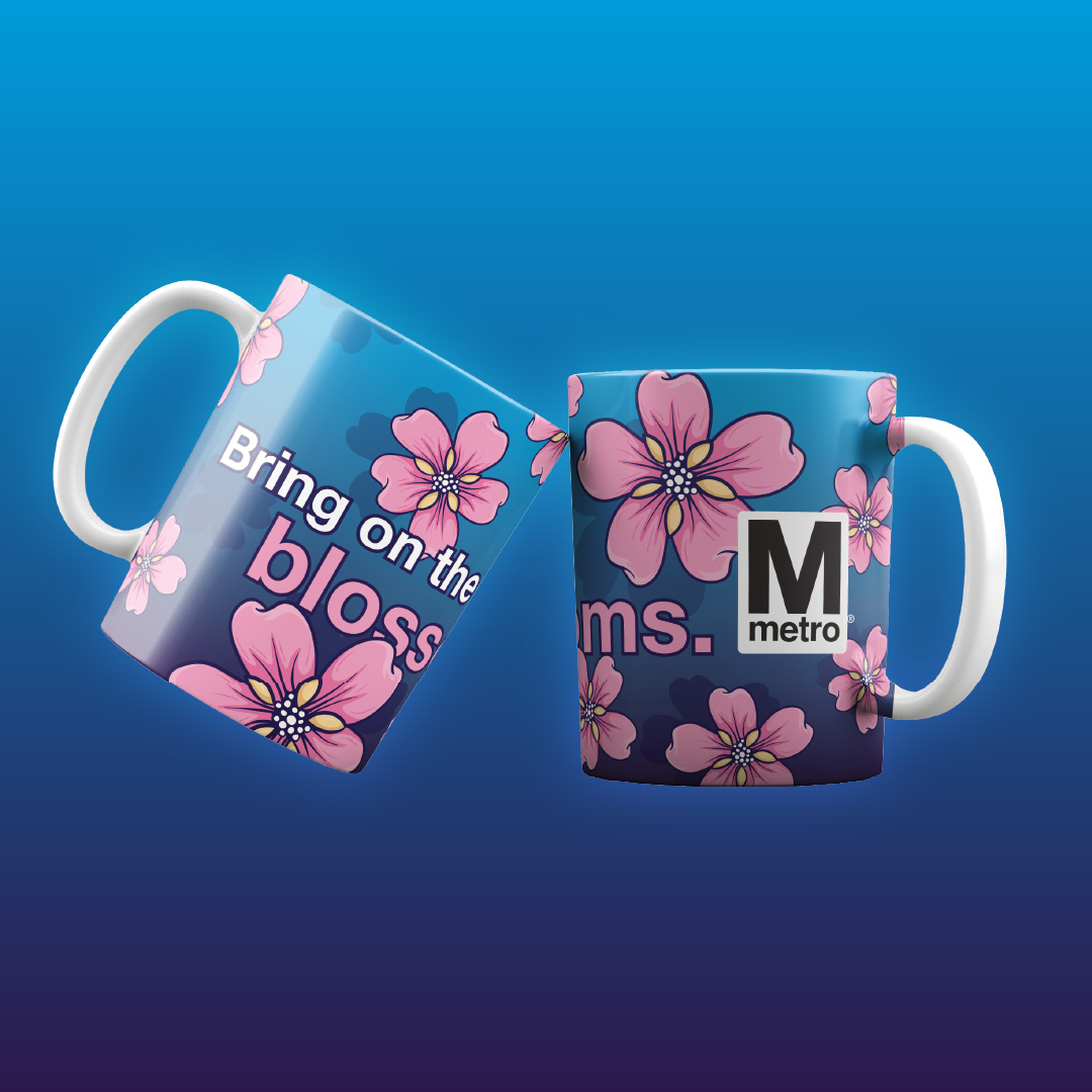 Blue and white coffee mug with large pink cherry blossoms